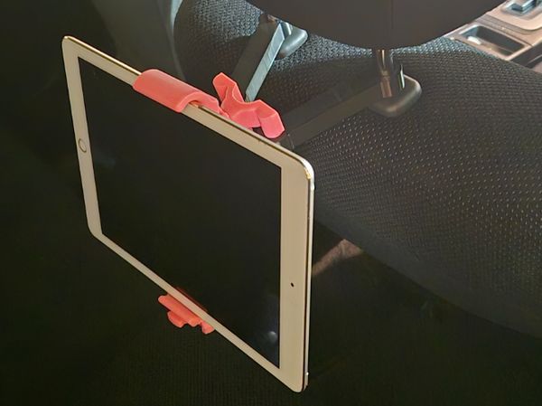 Pad/phone holder for back seat in car